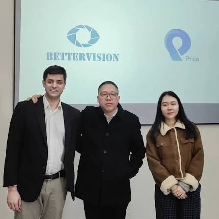 Team in front of BetterVision brand wall